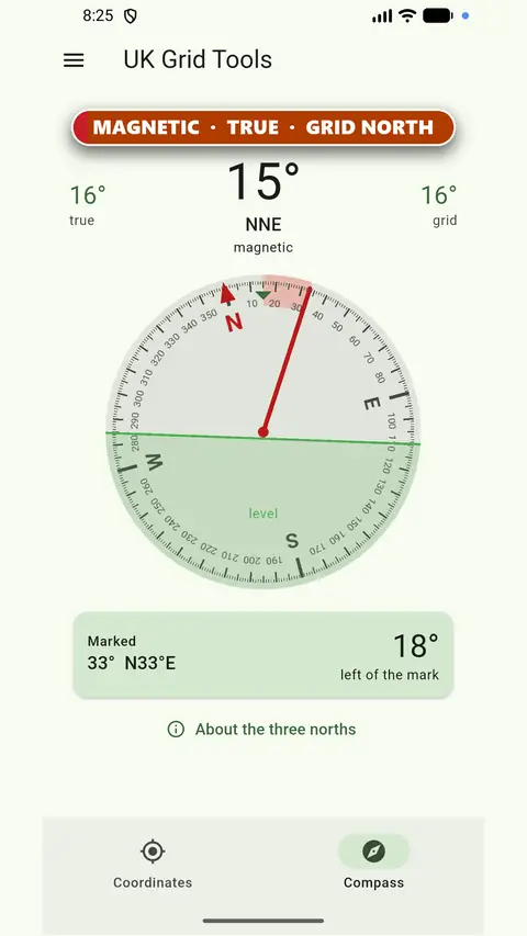 UK Grid Reference Finder compass screen showing magnetic, true and grid north with a spirit level
